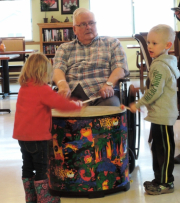 Male res drumming with two kids.jpg