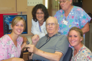 Male res (former Dr) with 4 staff all smiling.jpg