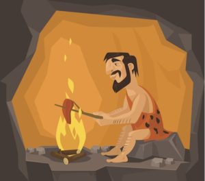 Cartoon illustration of caveman cooking in his cave