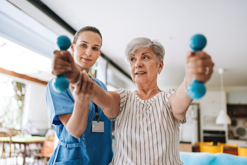 Patient at home doing physiotherapy with dumbbell